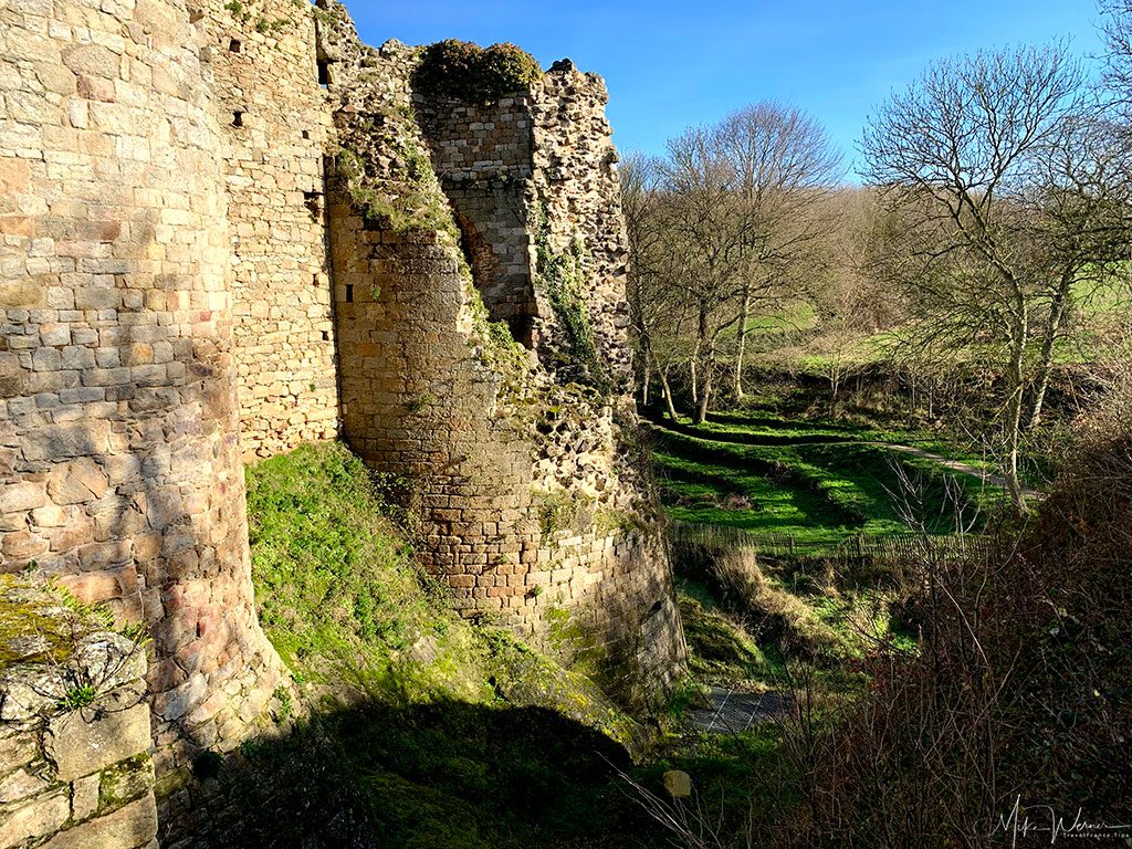 Large moats of the Guildo Fortress ruins in Saint-Jacut-de-la-Mer.