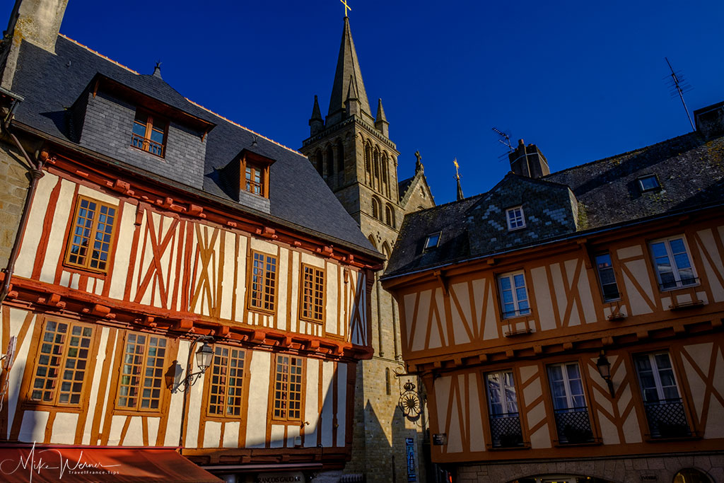 Wooden houses from the 15th century with church in the background in Vannes, Brittany