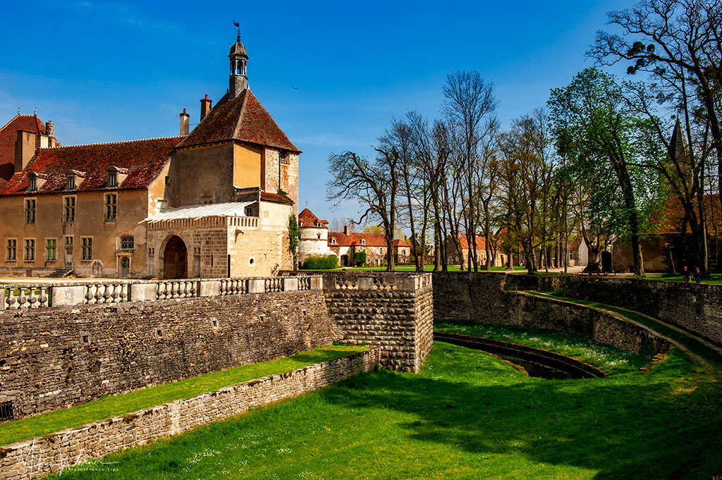 The moat and the church of the Epoisses castle in Burgundy