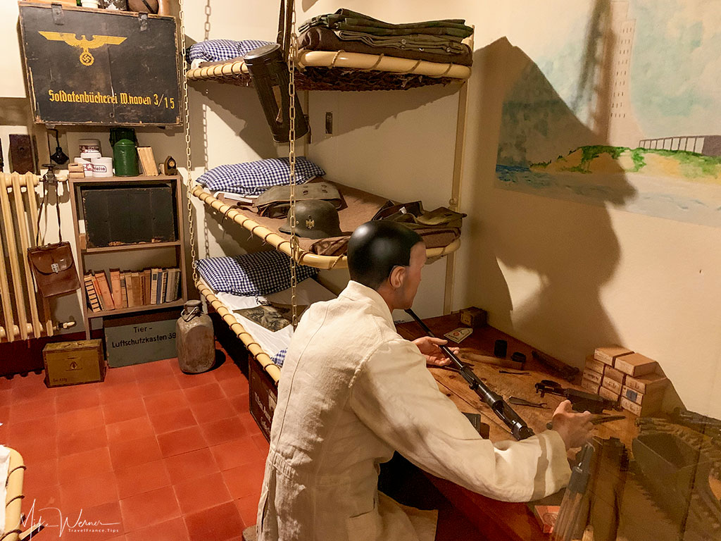 WWII German troop cleaning rifle at the 39-45 Memories Museum at Pointe Saint-Mathieu in Brittany