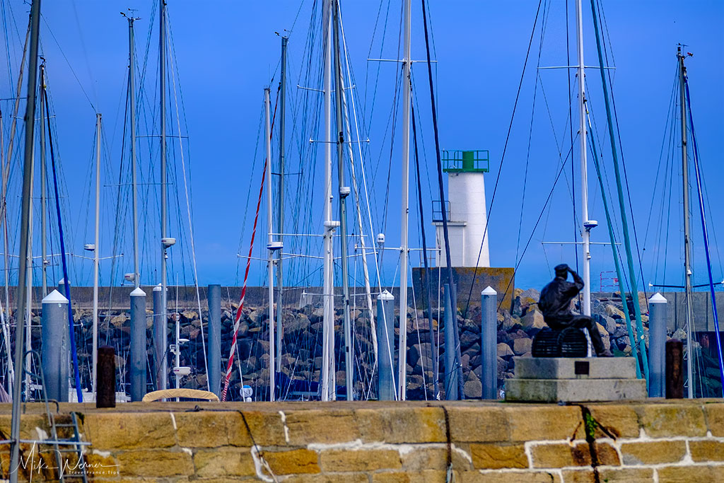 Fisherman statue looking to the sea at Port Haliguen in Quiberon, Brittany