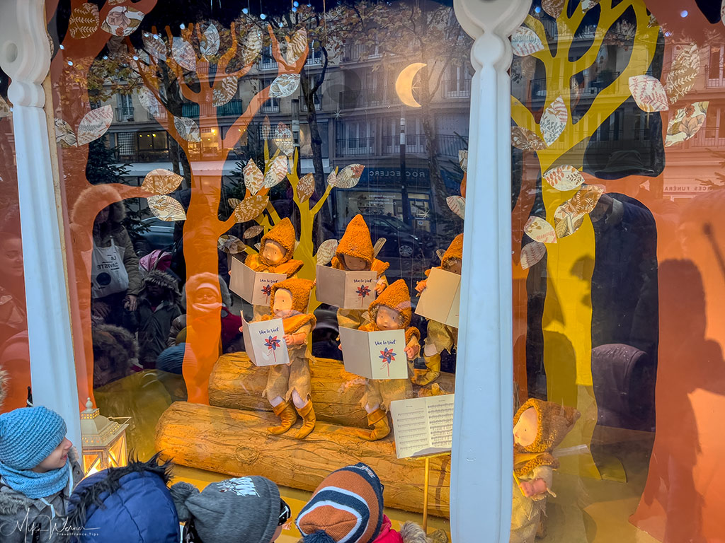 Children admiring the first of several Christmas scenes the Mairie