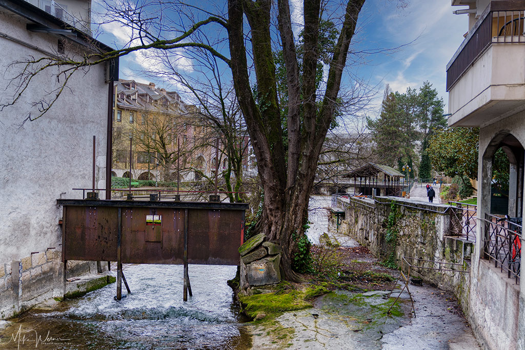 Lock after bridge over a canal in old Annecy